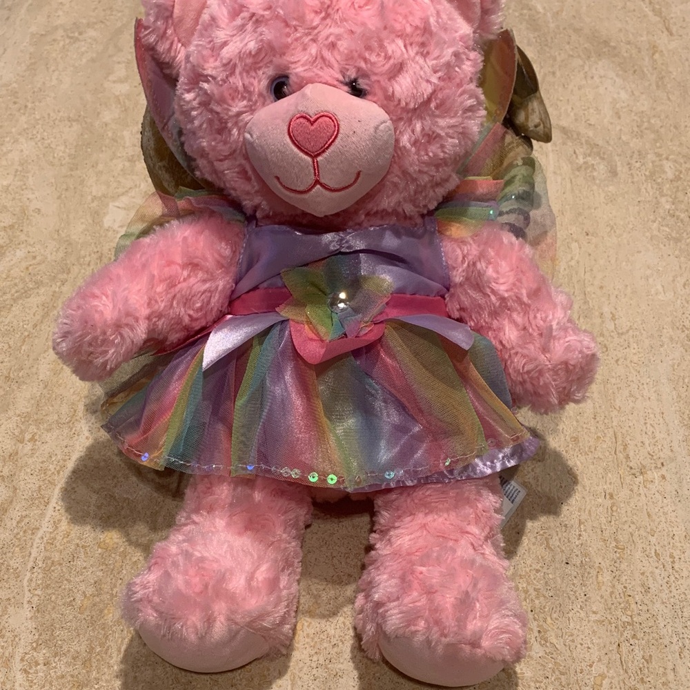 Build-A-Bear Pink Stuffed Animal with butterfly wings.